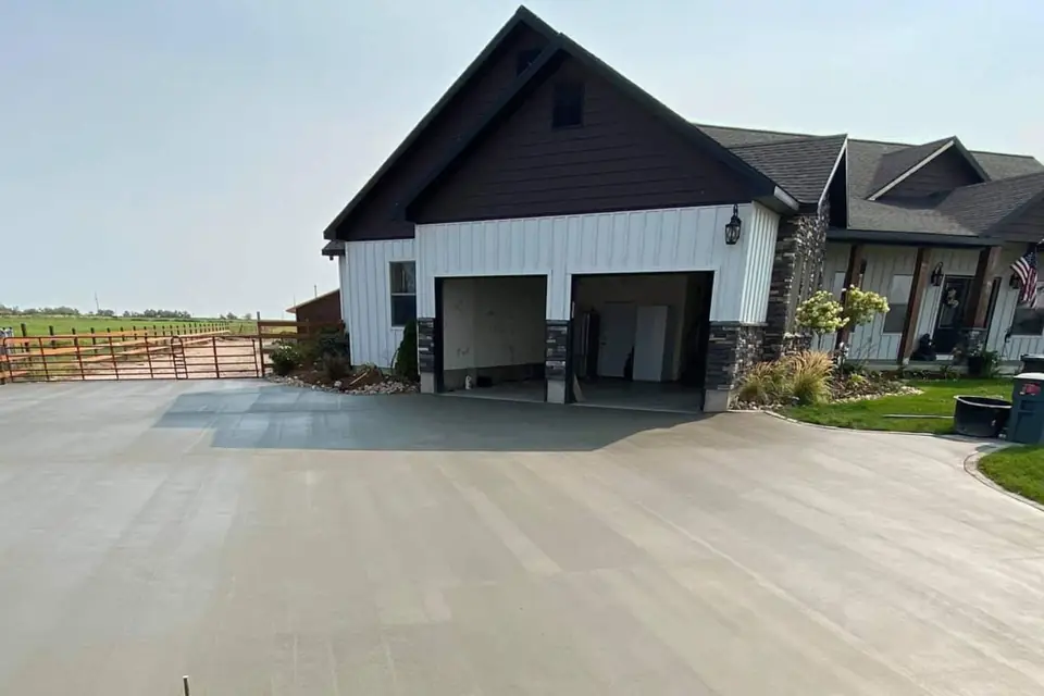 New concrete driveway poured by Morton &amp; Sons at a newly built home